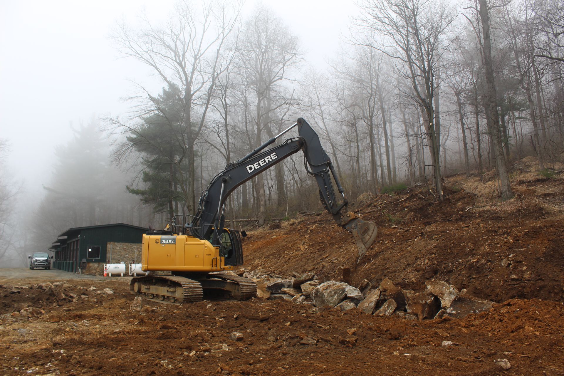 Building the retaining wall with rocks and boulders.