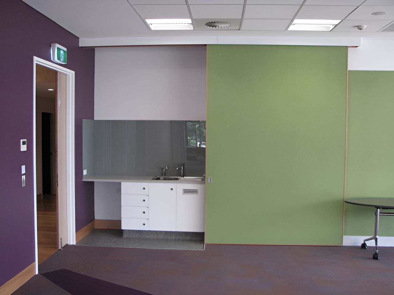 An Empty Room With Purple Walls And Green Walls — North Coast Cabinets In Tweed Heads, NSW
