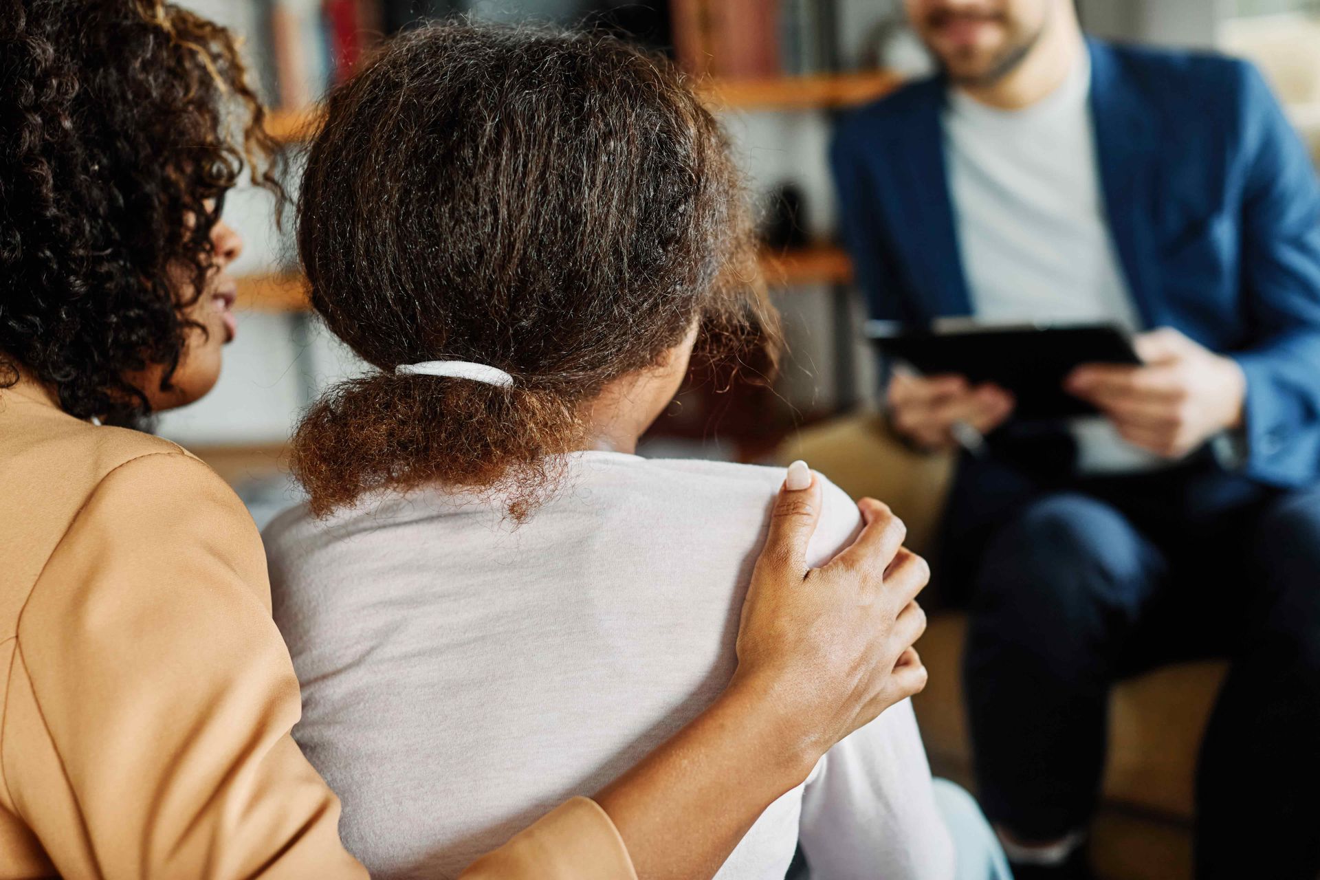 Mother with her teenage daughter at meeting with the psychiatrist. Mother with her teenage daughter at meeting with the psychiatrist.