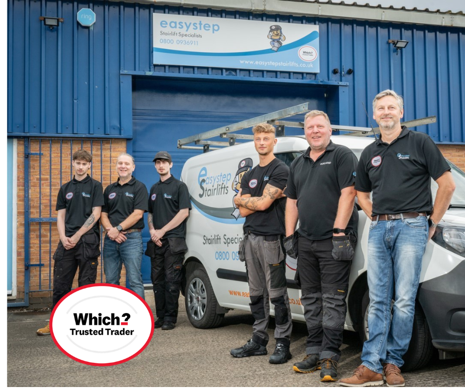 Five men posing in front of a blue service van and workshop building with a Which? Trusted Trader badge