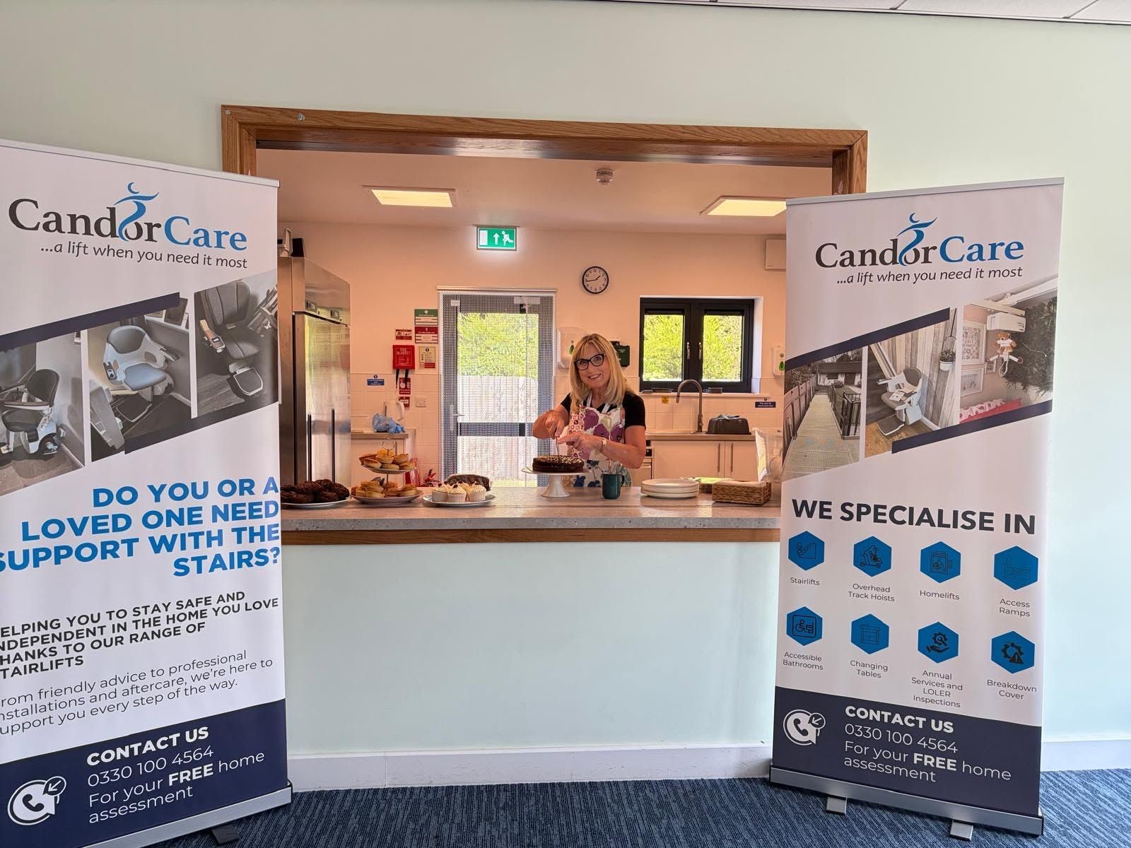 CandyCare support booth with banners and a person behind a reception counter indoors