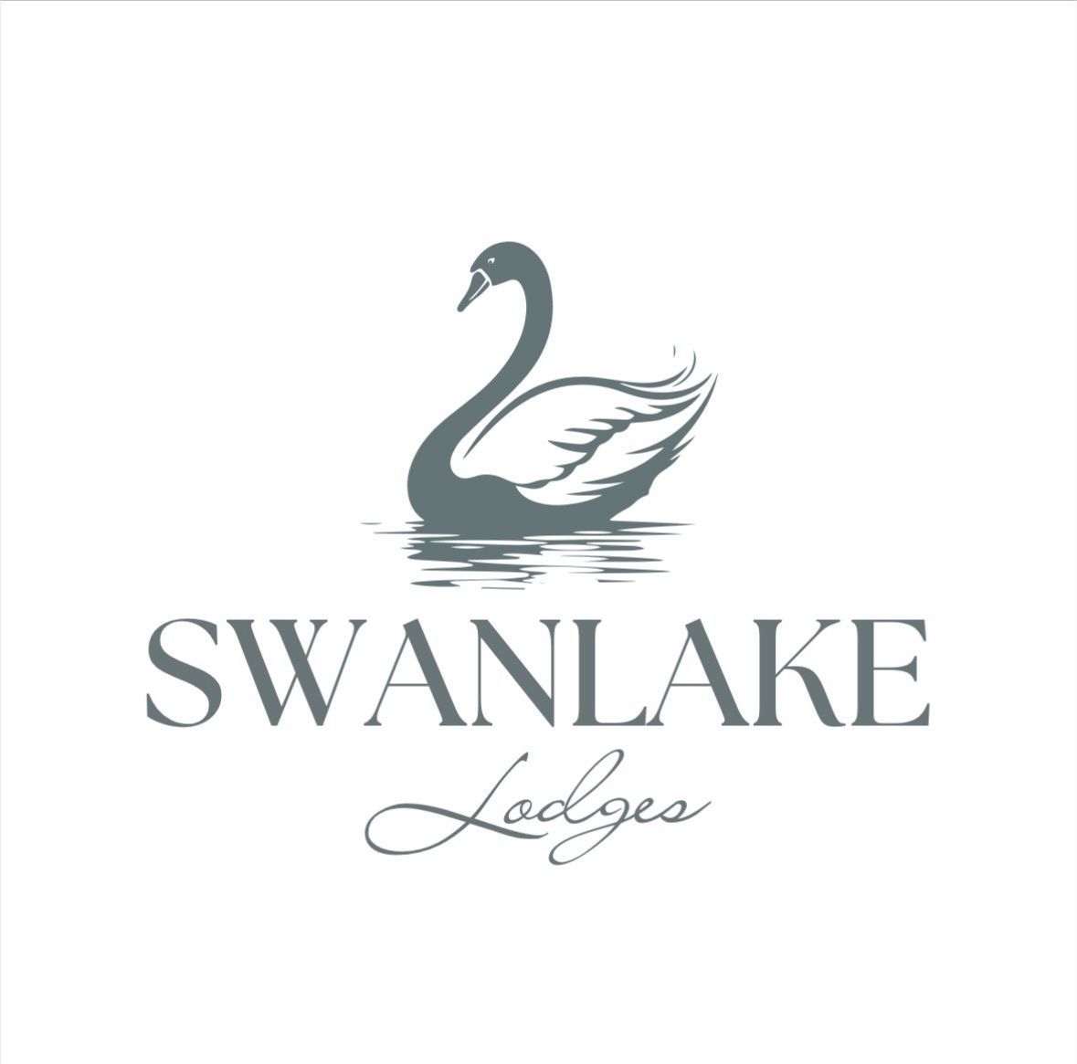 Logo of a gray swan with “SWANLAKE” and cursive “Lodges” beneath on a white background