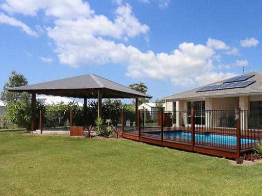 House with a Pool and a Fence — Coffs Harbour, NSW — Coolamon Concrete Tanks