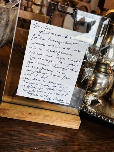Handwritten note in glass frame; message of gratitude for guidance.