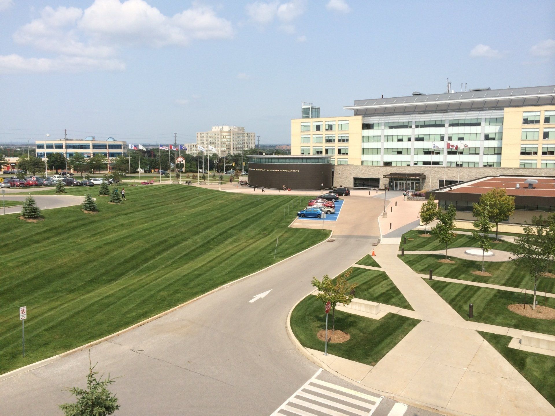 A large building with a lot of grass in front of it