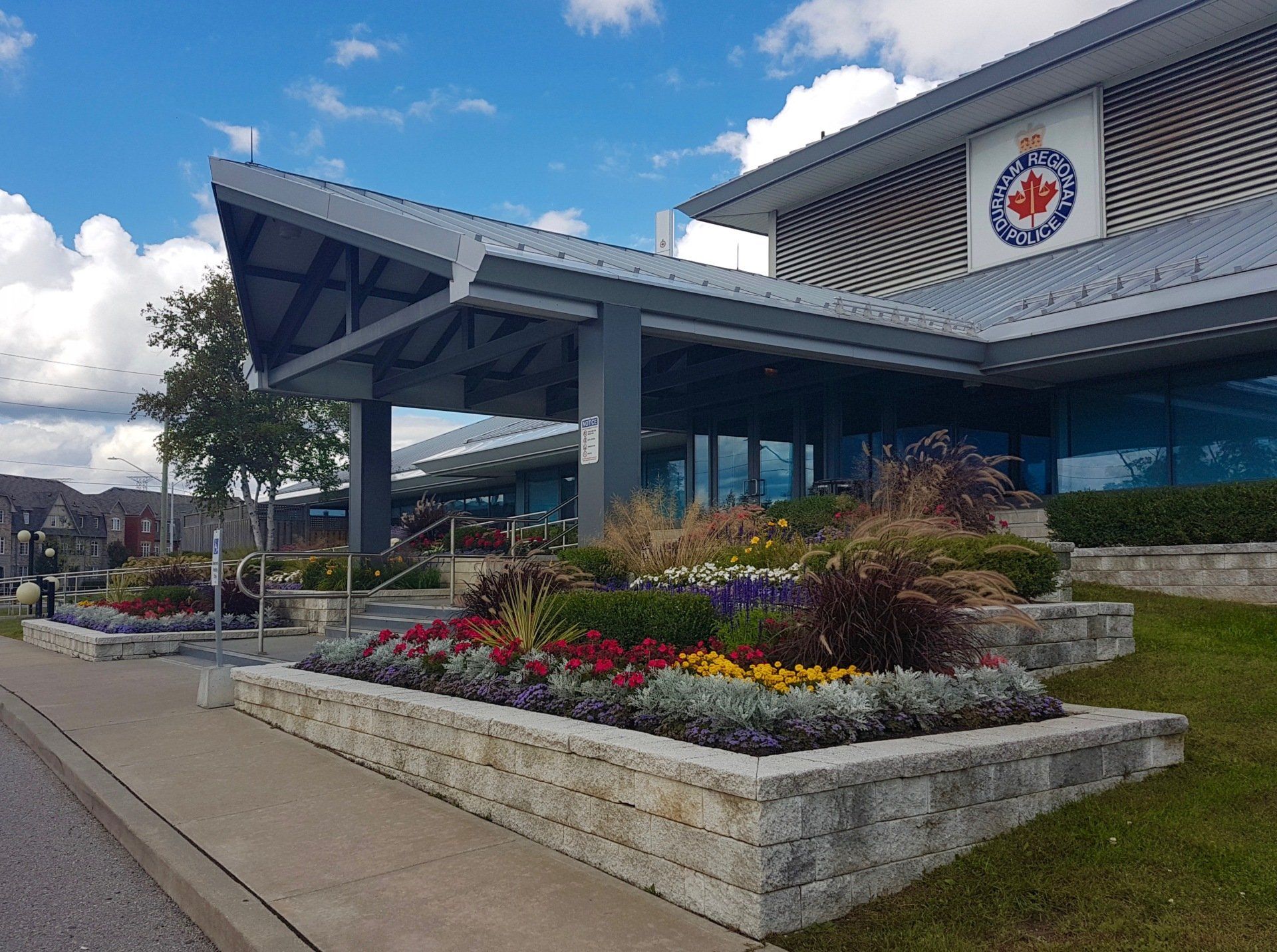 A large building with flowers in front of it