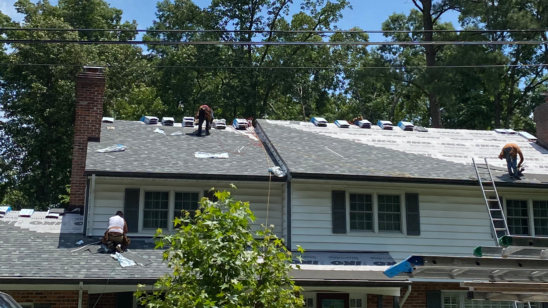 Two Men are working on the Roof of a House - Chester, VA - A. Townsley Contracting