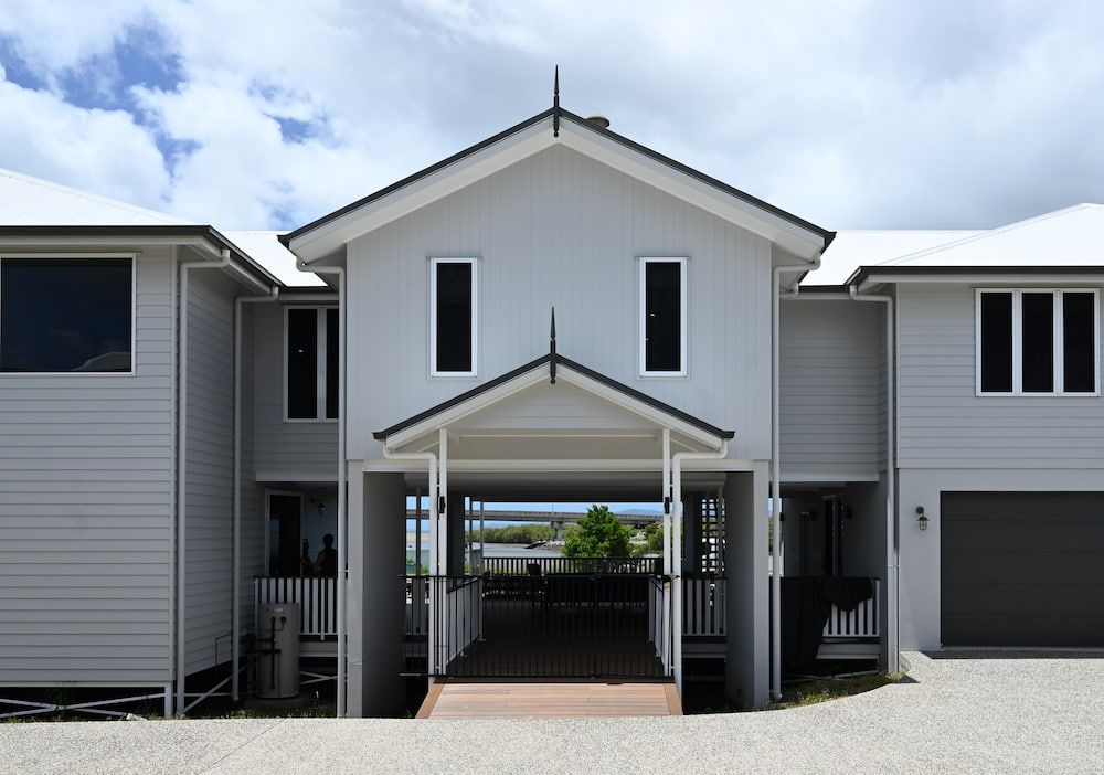 A Large White House With a Driveway Leading to It — Drawing Works In Townsville City, QLD