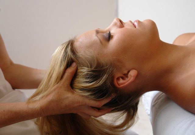 Gentle scalp massage during an Indian head massage in Coventry