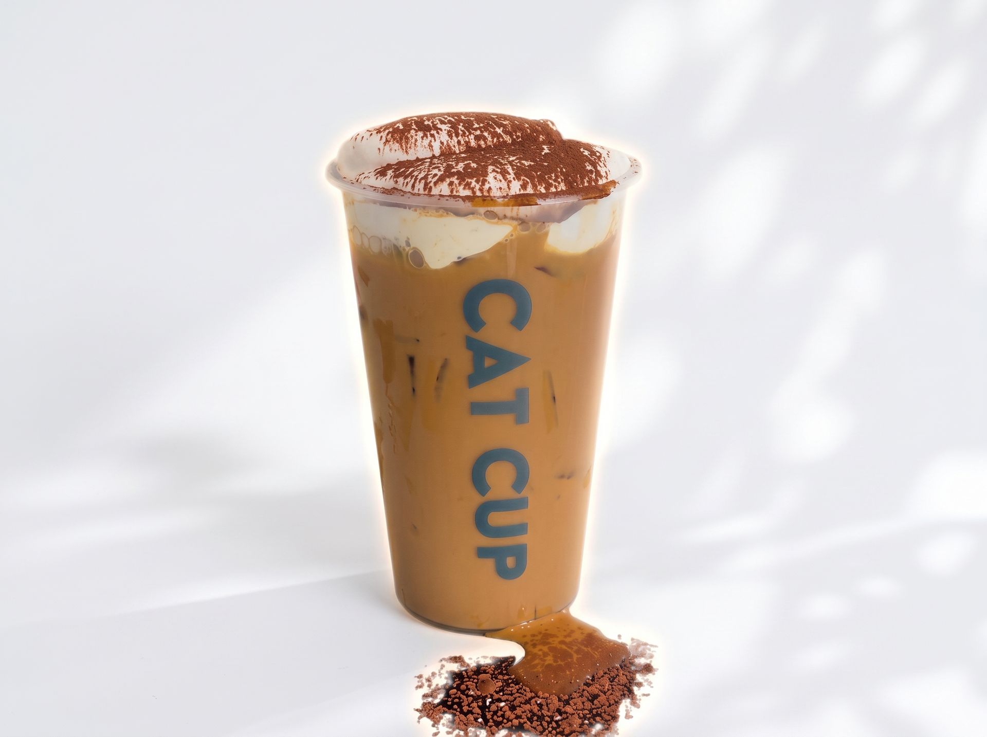 CAT CUP coffee cup with spilled grounds on a white background