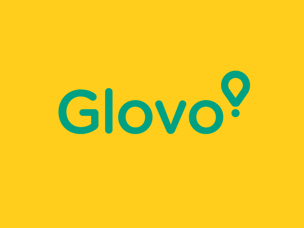 The logo for glovo is green and yellow on a yellow background.