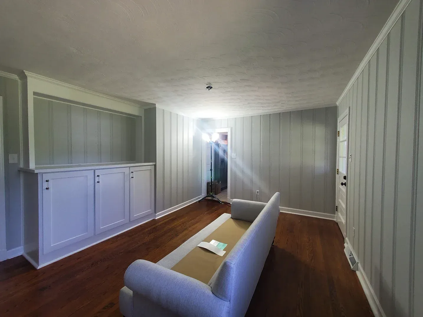 Gray Painted Wood Panelling with White Trim