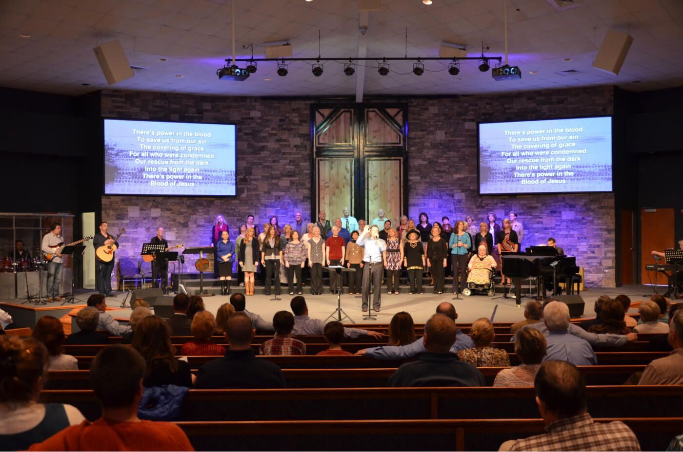 a group of people on a stage Lake Hills project