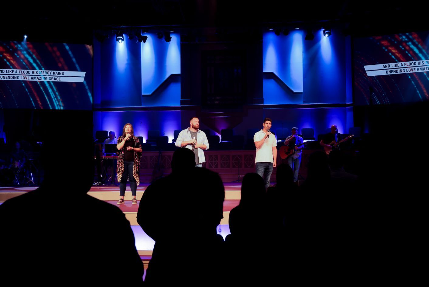 3 people at the stage