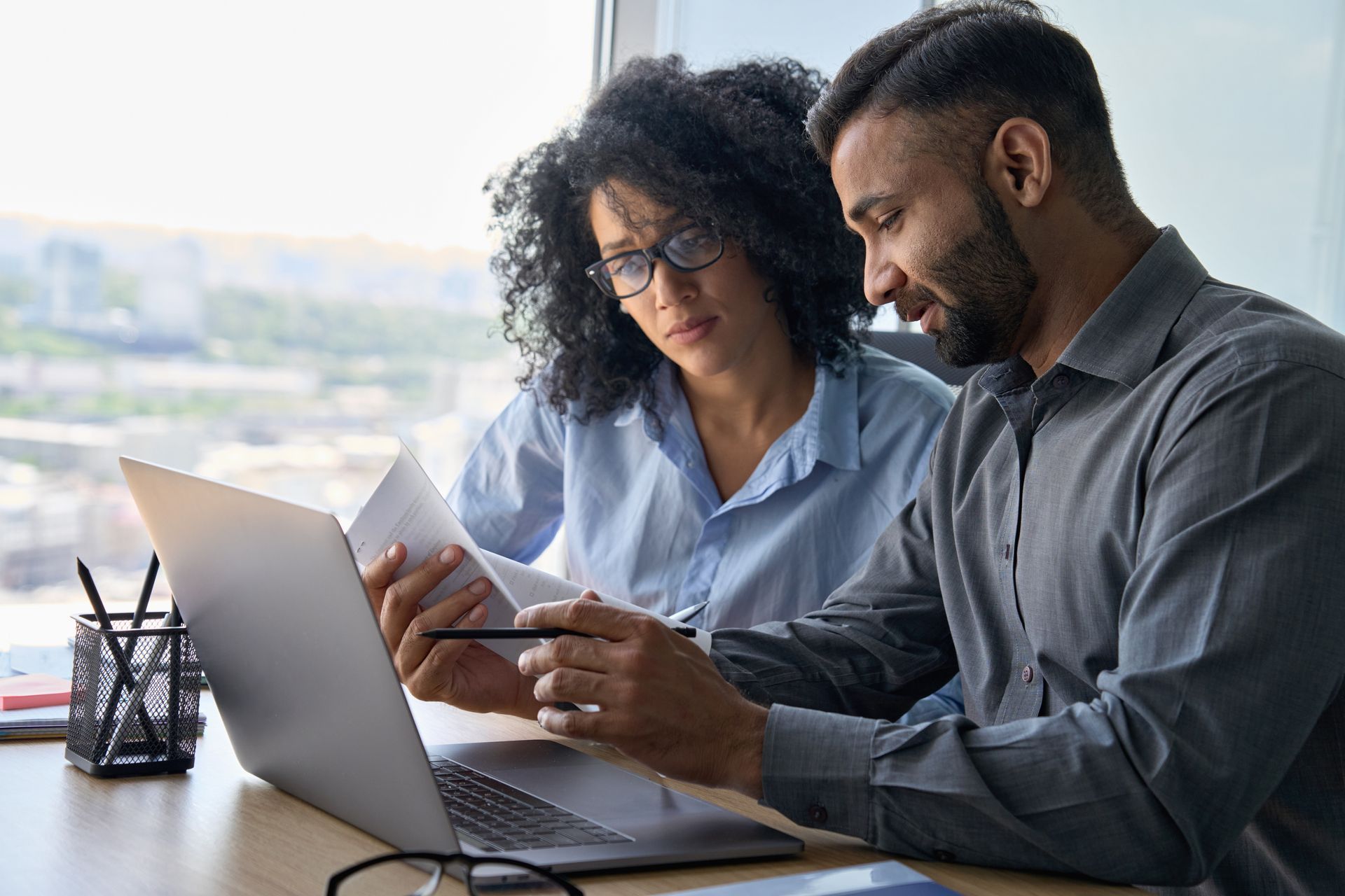 Two people looking at laptop