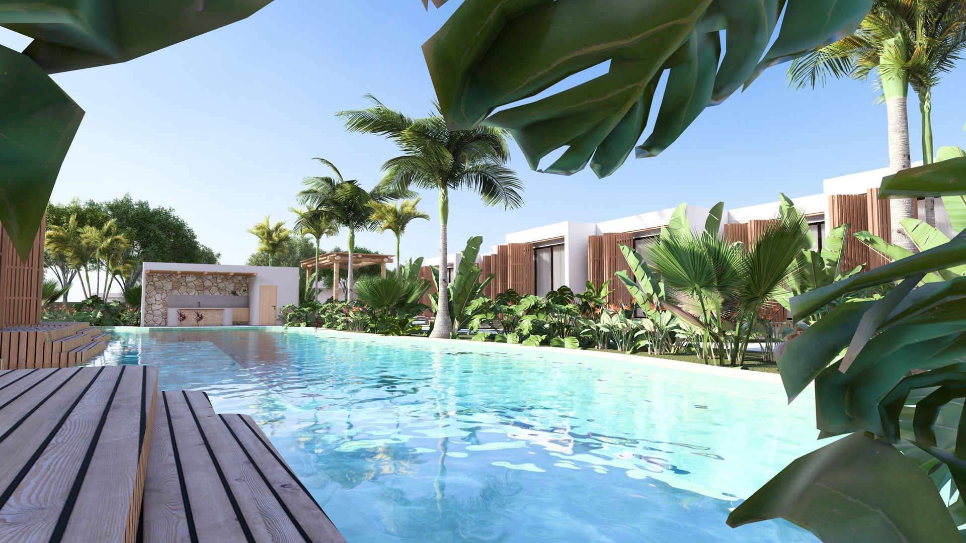 Piscina com deck de madeira, folhagem tropical exuberante e edifícios modernos sob um céu ensolarado.