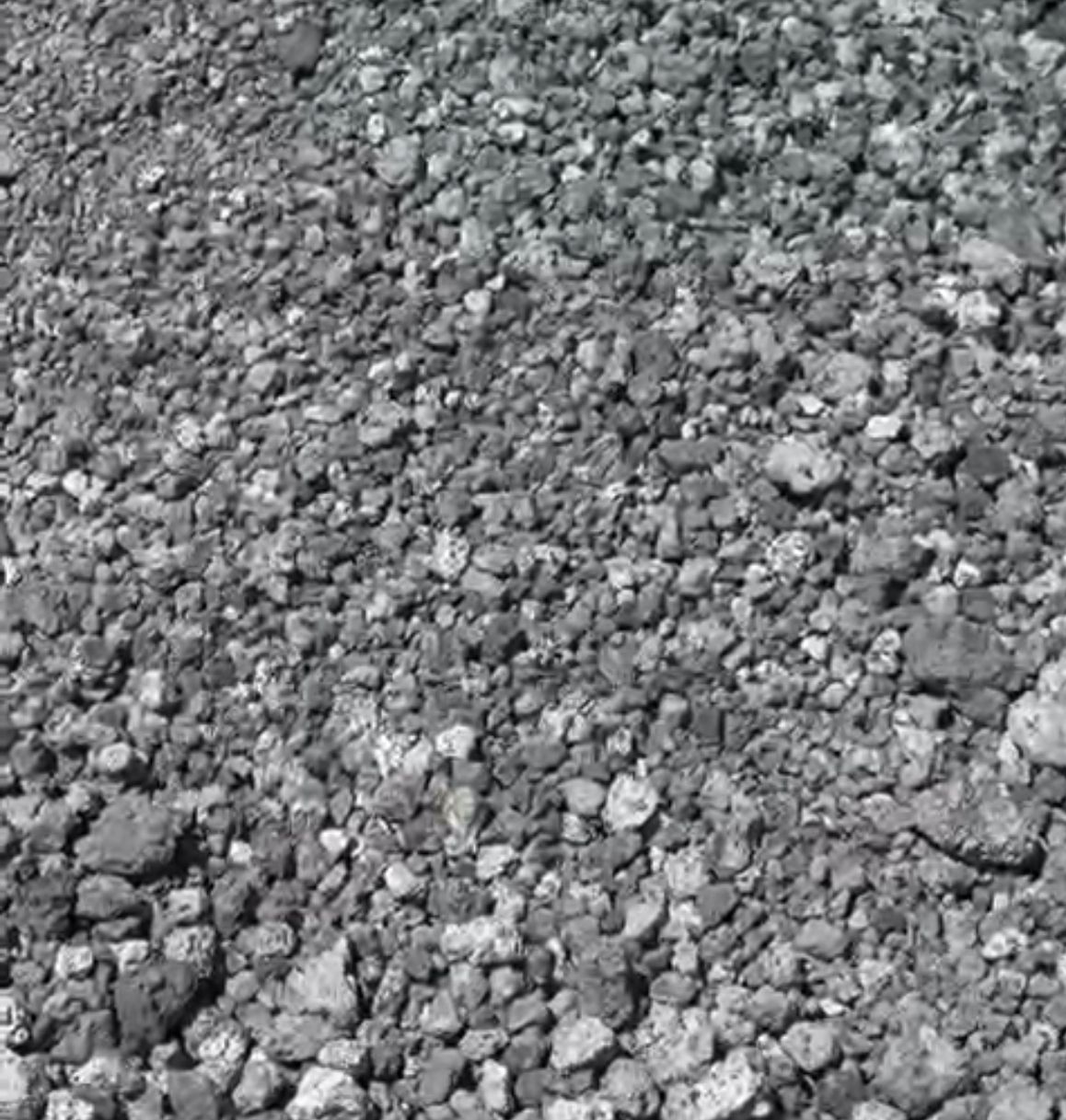Pile of gray, jagged gravel stones.