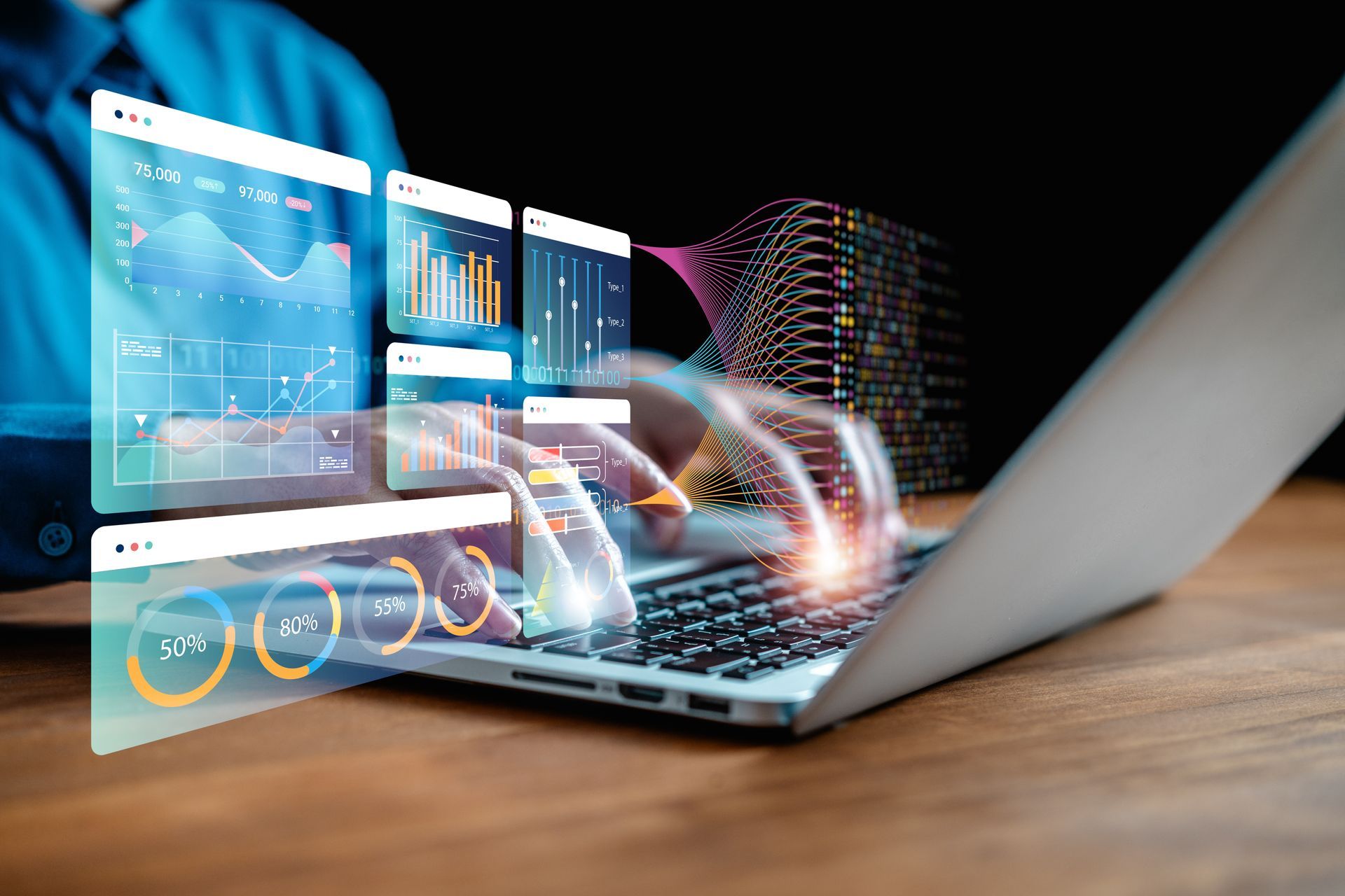 Transparent analytics dashboards hovering over a laptop on a desk, with colorful data graphs and digital motion trails