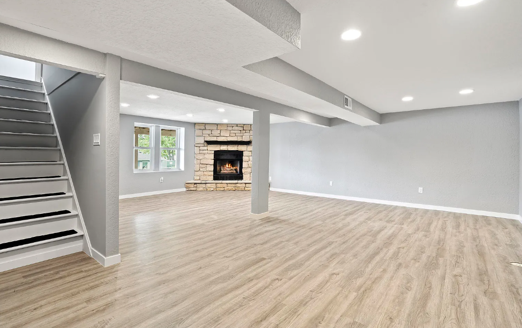 Updated stairway at Lori St with contemporary railings and elegant flooring.