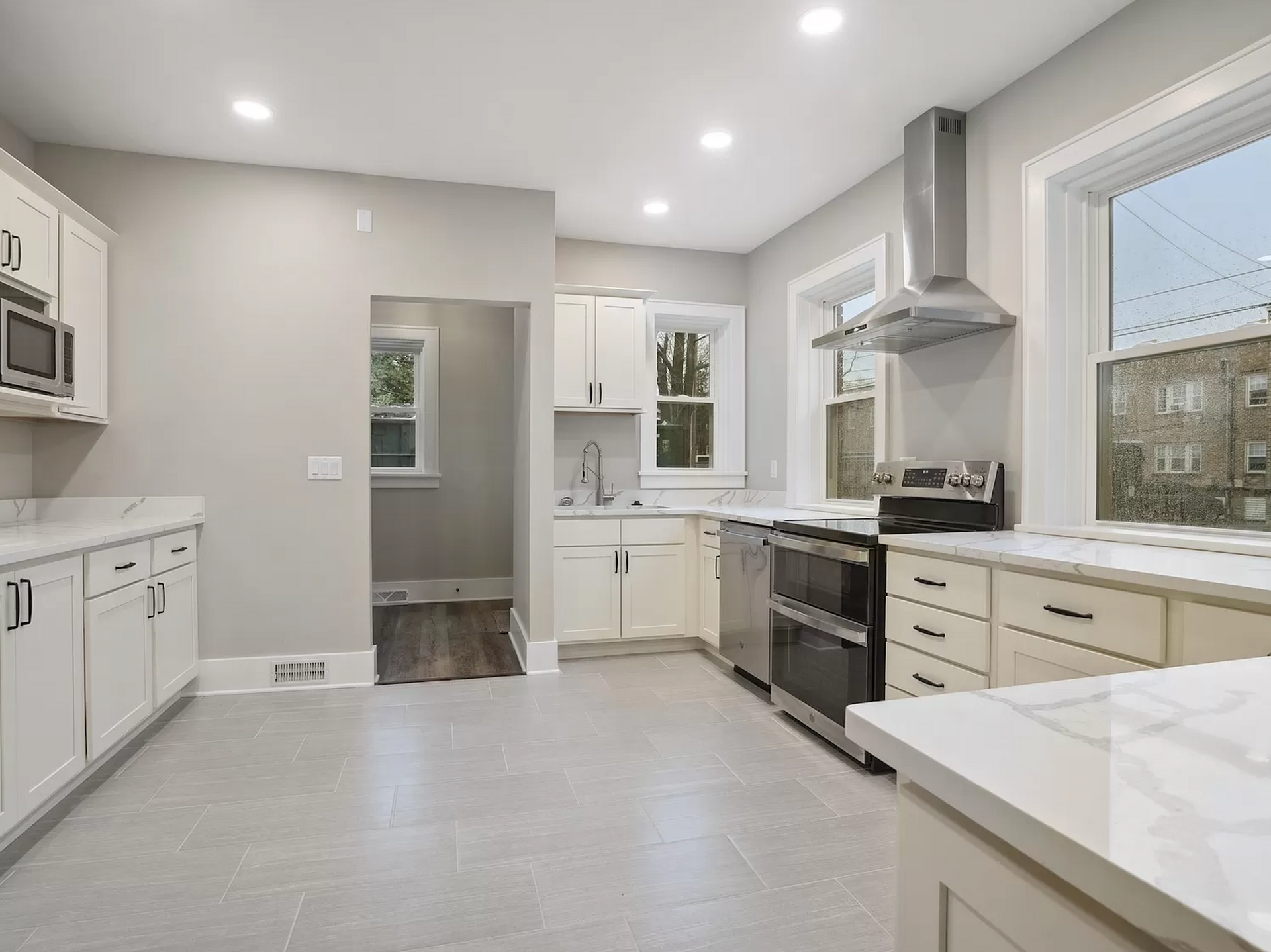 Stunning kitchen renovation featuring custom cabinetry, high-end appliances, and a spacious island.
