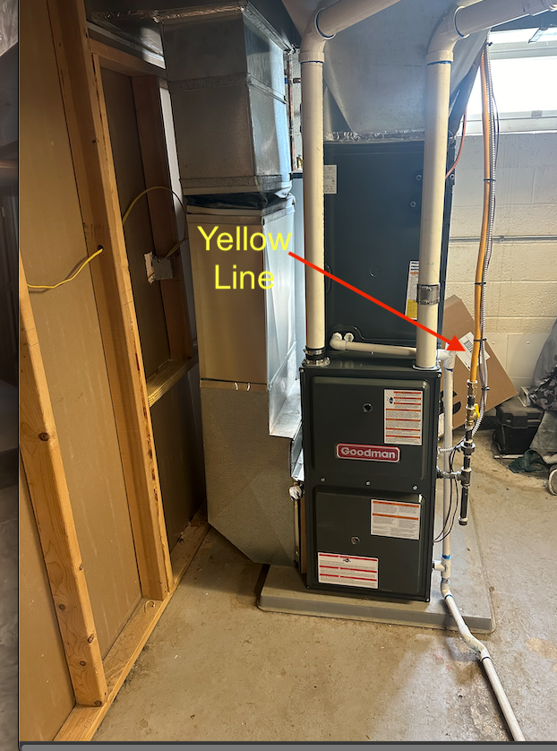 Professional gas line installation demonstrating proper grounding techniques for home safety.