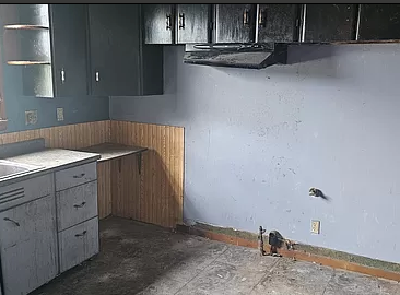 Stove area of kitchen before the remodel. 