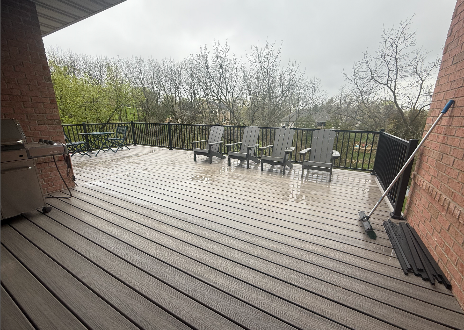 Backyard makeover featuring newly constructed deck by AMC Homes
