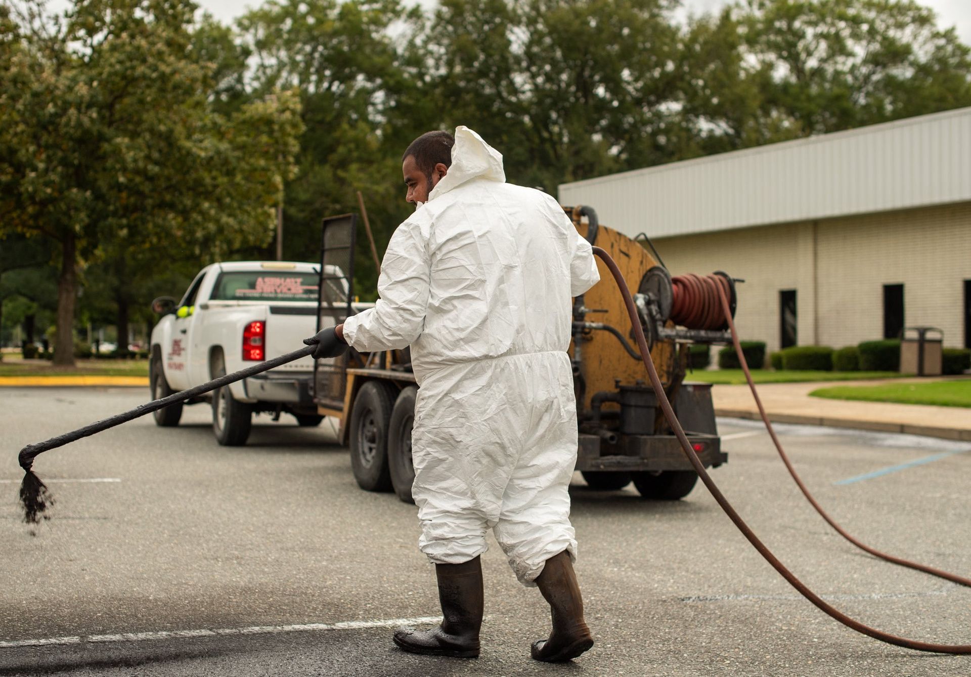 Hand Touching a Crack on Asphalt — Pikefield, NC — Asphalt Services of Goldsboro Hand Touching a Crack on Asphalt — Pikefield, NC — Asphalt Services of Goldsboro