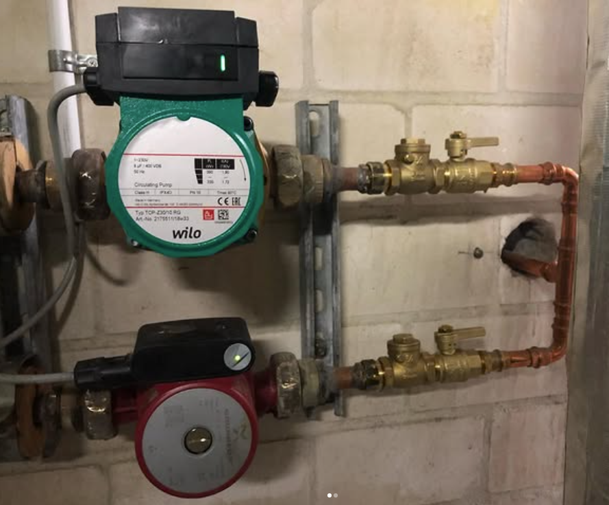 Circulator pump and manifold installed for a pump water distribution system
