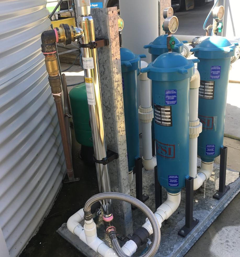 Recycled water filtration housings installed on a pump system