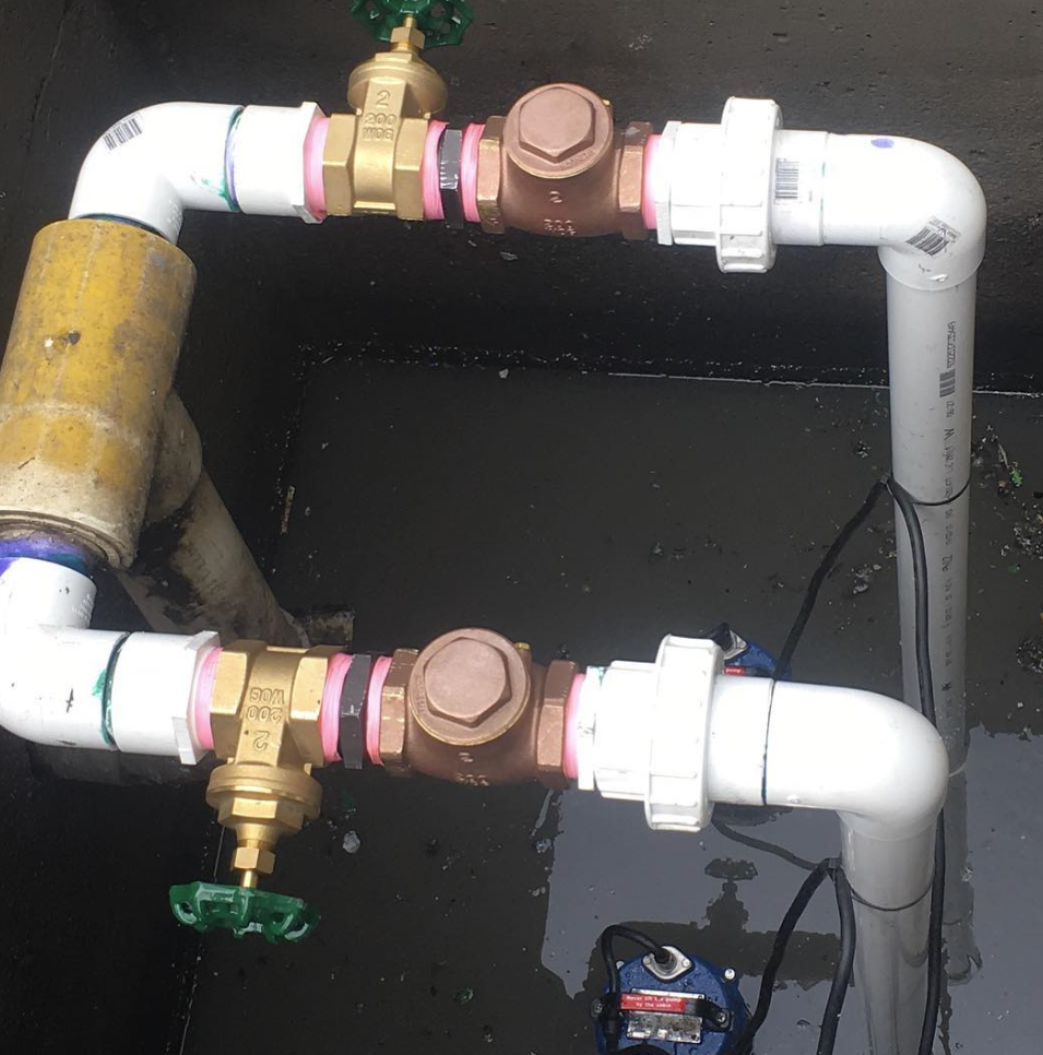 PVC pipework and fittings under repair on a pump system