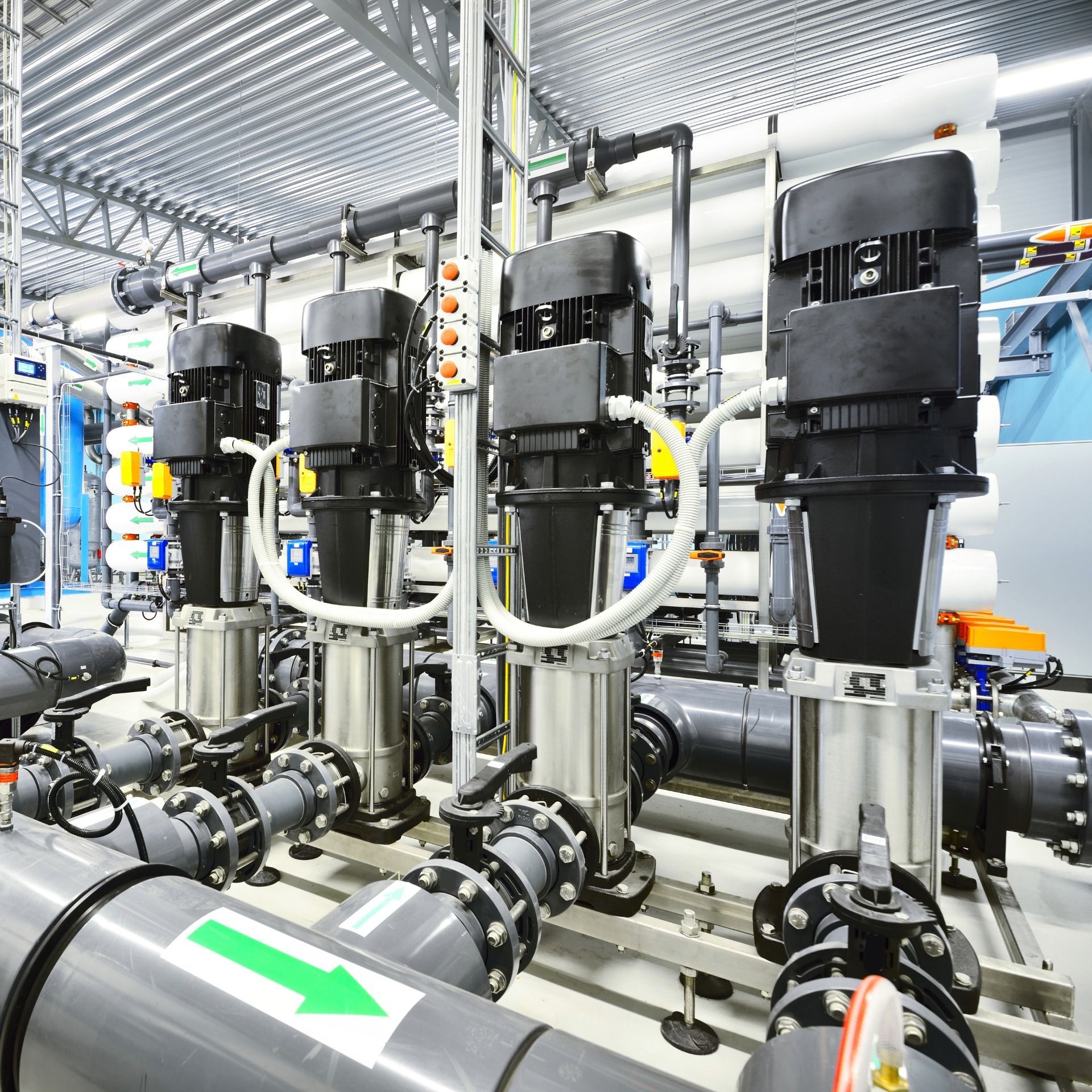 Water treatment plant equipment with pipes and pumps.