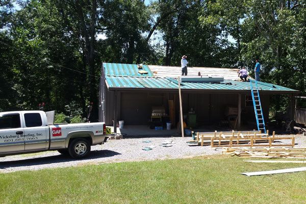 seam metal roof construction in progress
