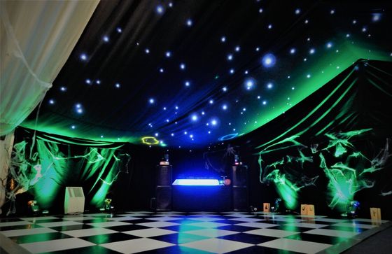 Green uplighting at a Halloween party