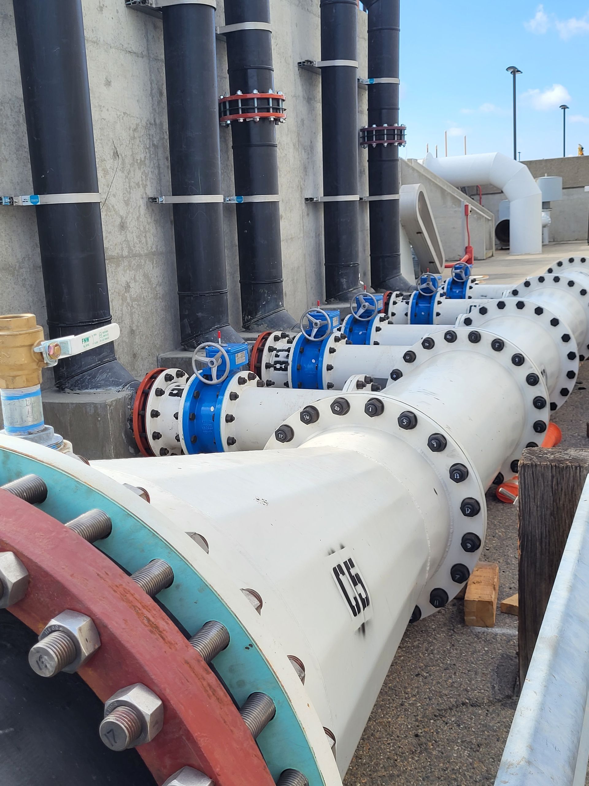 5D Company llc a bunch of pipes are lined up in a row