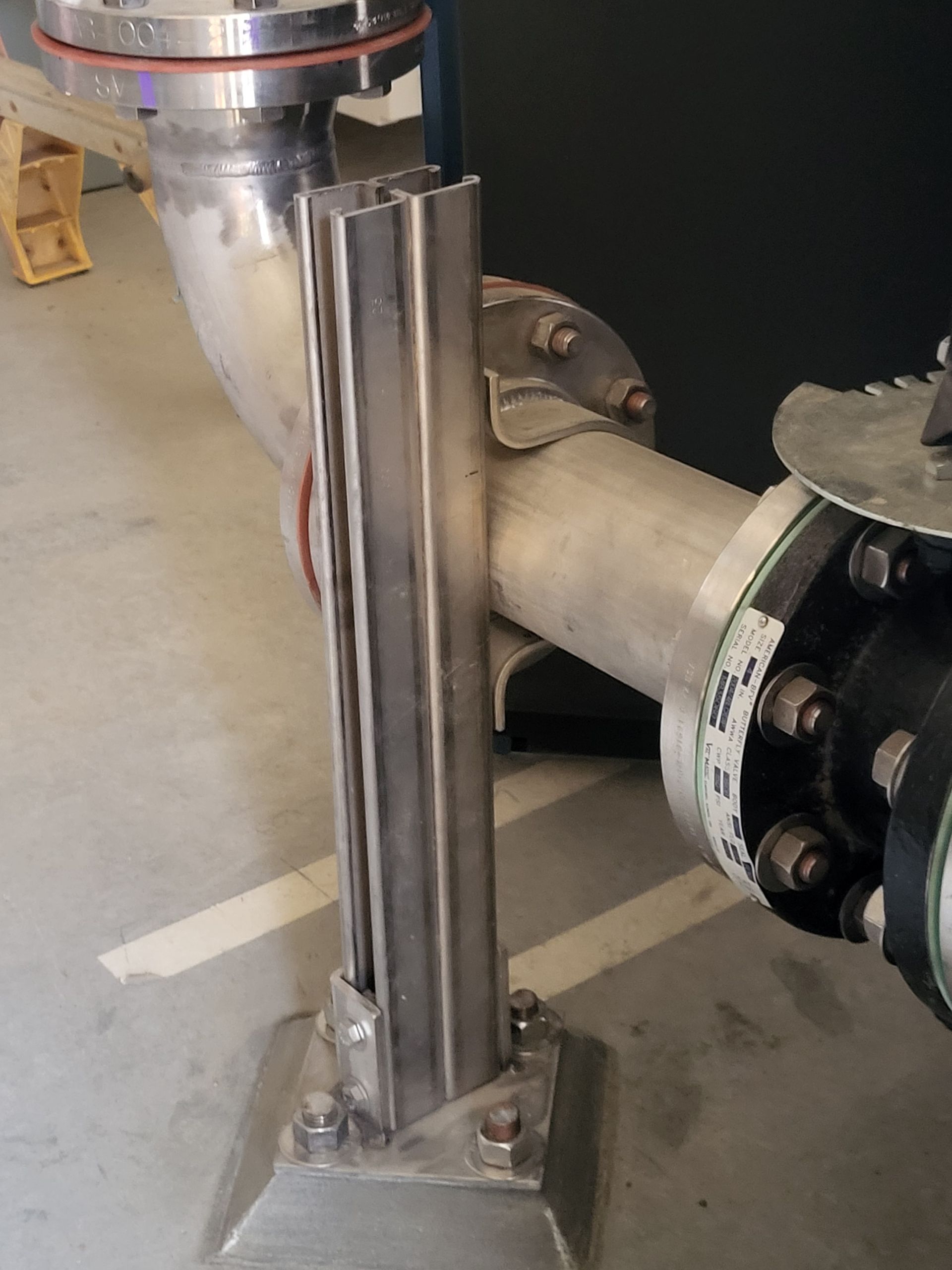 5D Company llc a stainless steel pipe with a flange attached to it