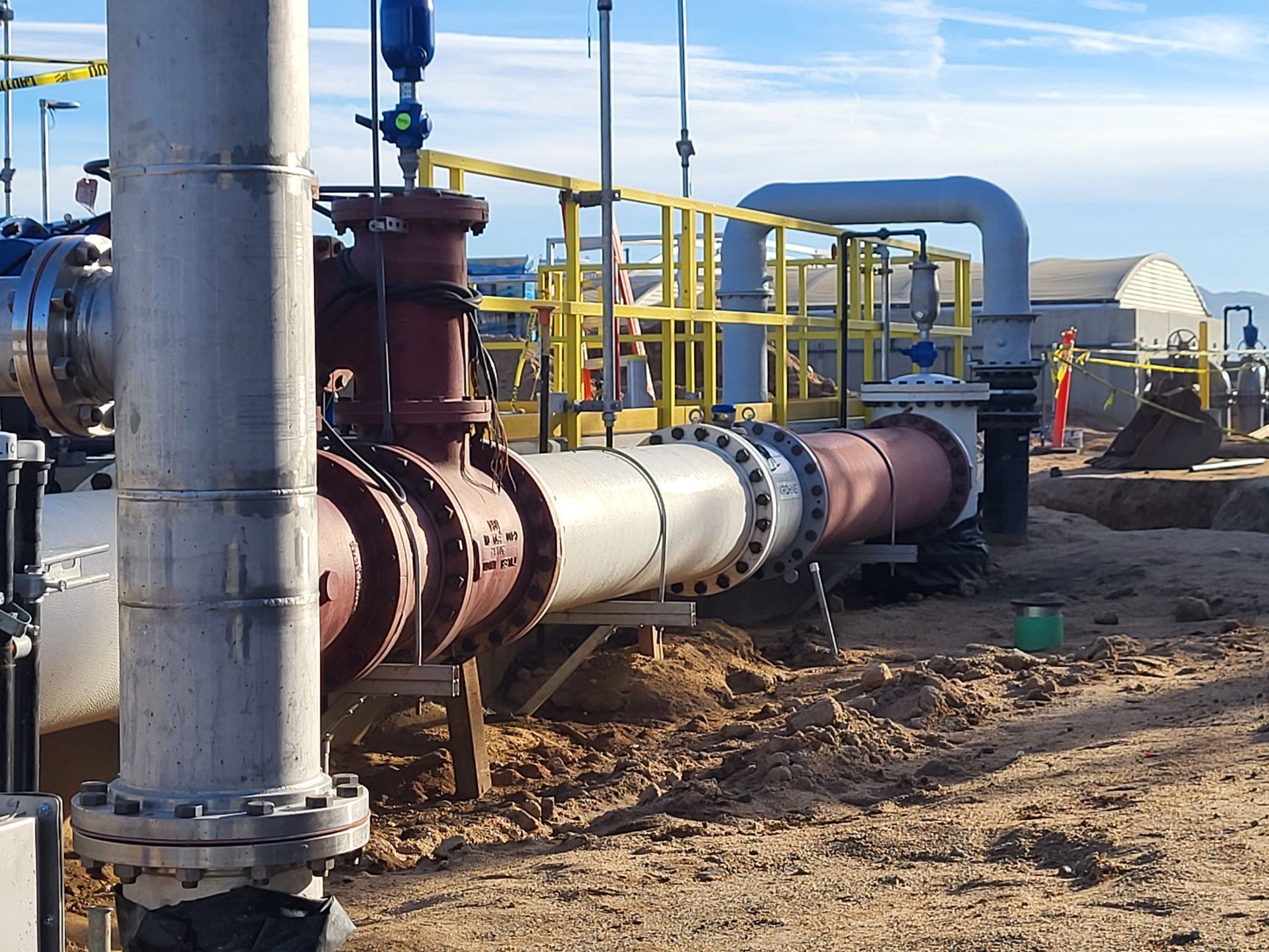 5D Company llc a bunch of pipes are lined up in the dirt