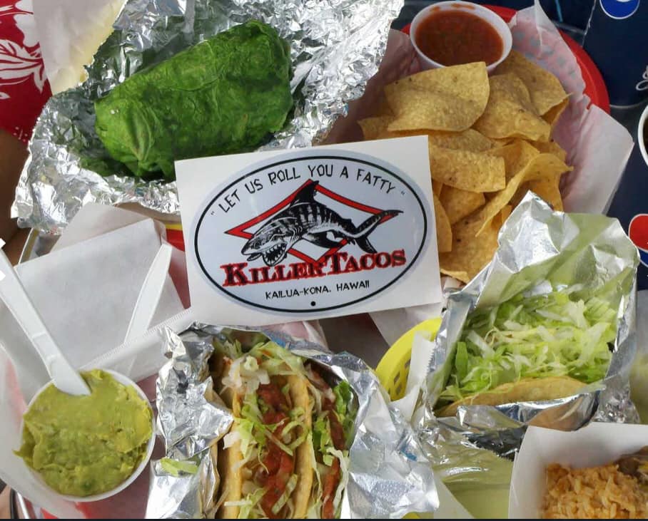 Killer Tacos meal: large burrito, tacos, chips, guacamole, salsa, and lettuce.