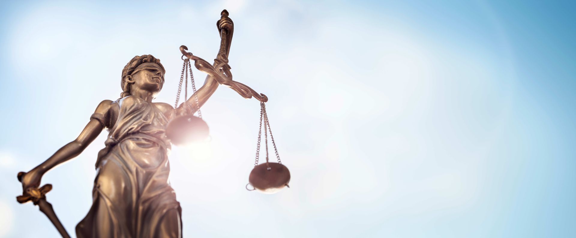 Legal law concept statue of Lady Justice with scales of justice sky background Legal law concept statue of Lady Justice with scales of justice sky background