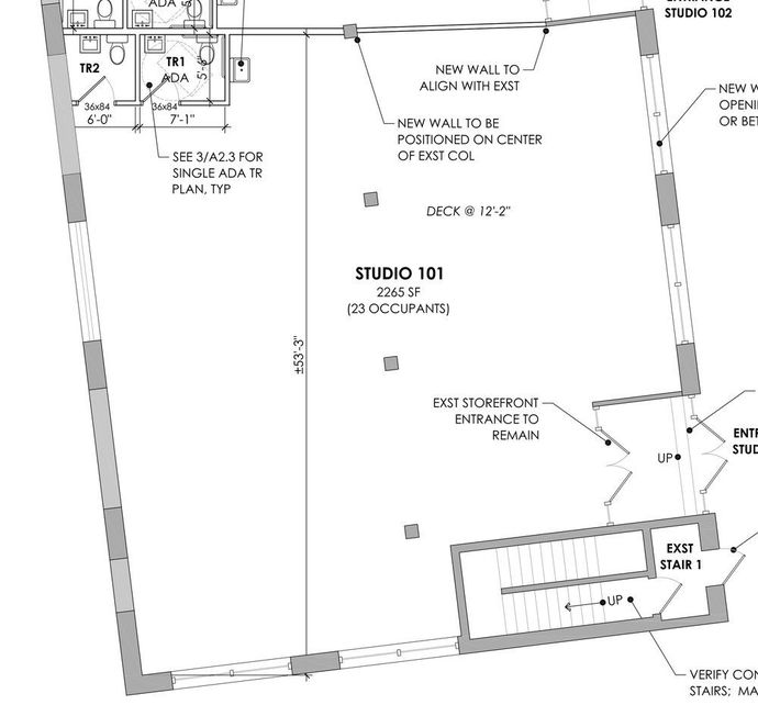 a black and white floor plan of a building with stairs .
