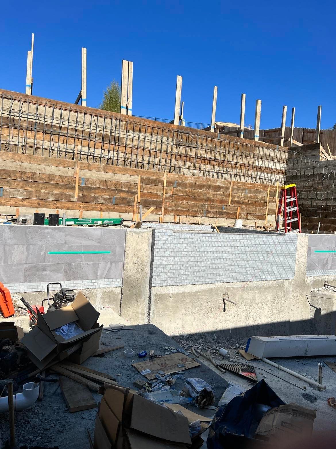 WEST VILLAGE CONCRETE RETAINING WALL PARTIALLY COMPLETE