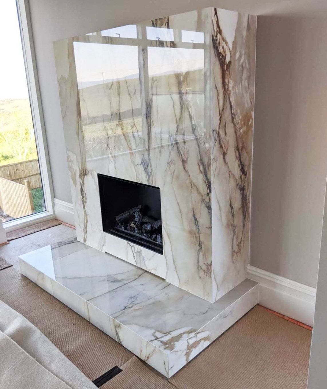 Marble fireplace surround for modern living room design.