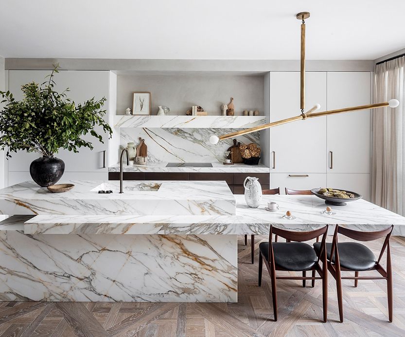 A kitchen with a marble countertop.