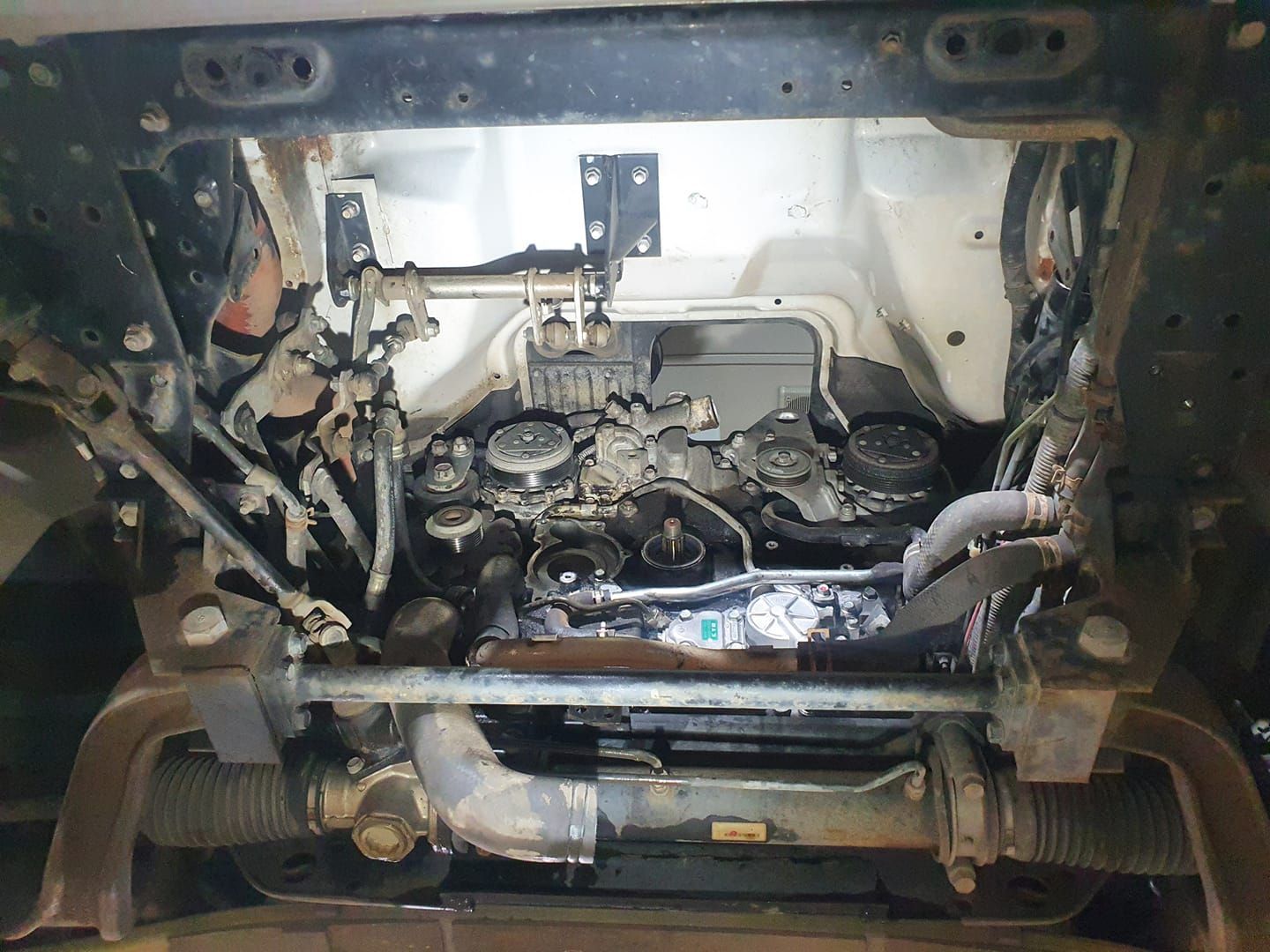 A View Into an Open Car Engine Bay Showing Various Pulleys — B & W Commercials In Wauchope, NSW