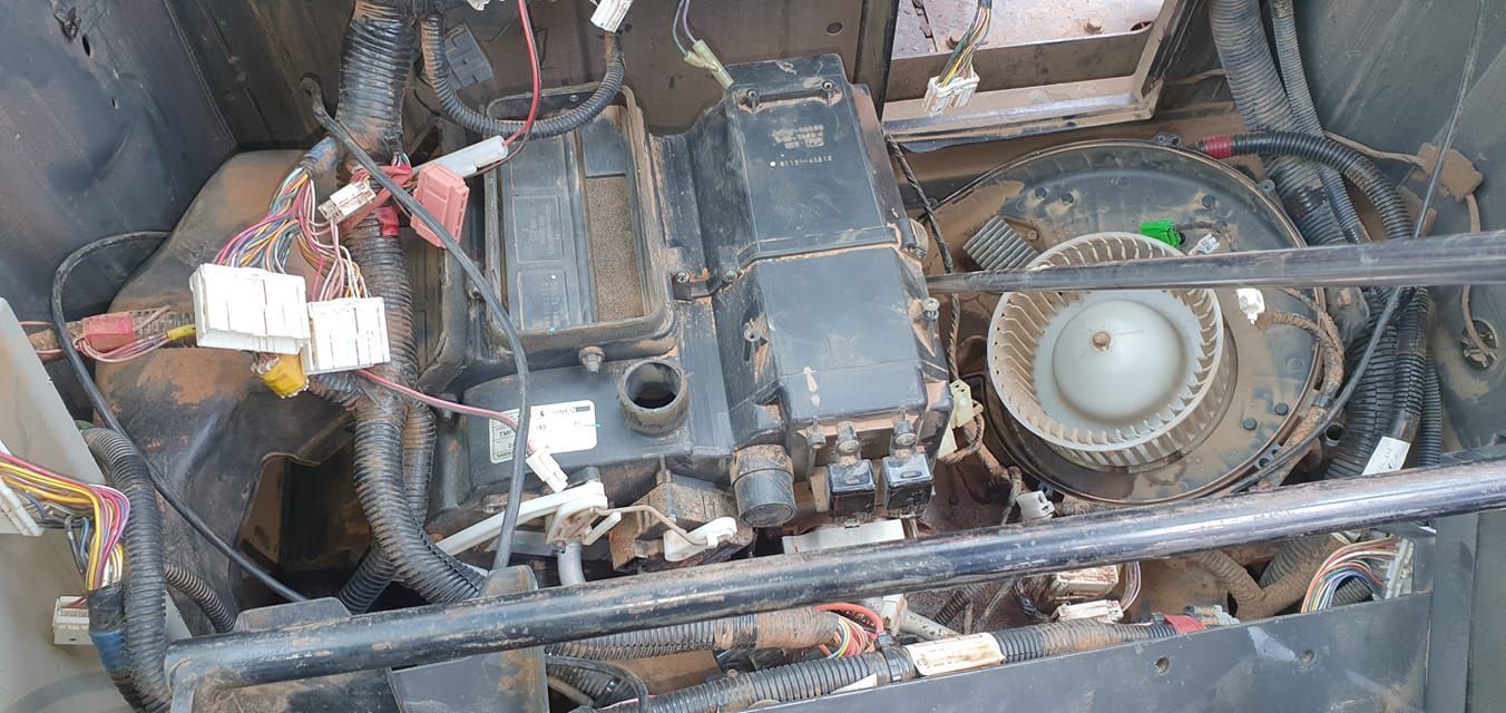 An Exposed Automotive Hvac Blower Motor and Heater Core Assembly — B & W Commercials In Port Macquarie, NSW