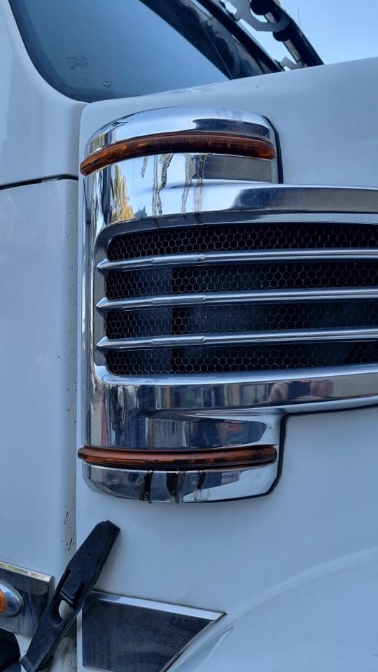 Close-up of a White Truck's Chrome Side Vent — B & W Commercials In Kempsey, NSW