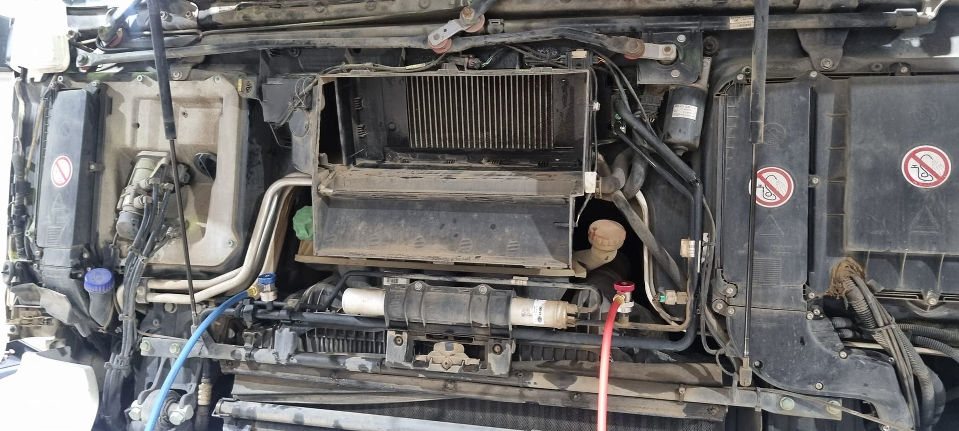 The Exposed Front Engine Bay of a Truck With Visible Wiring — B & W Commercials In Wauchope, NSW