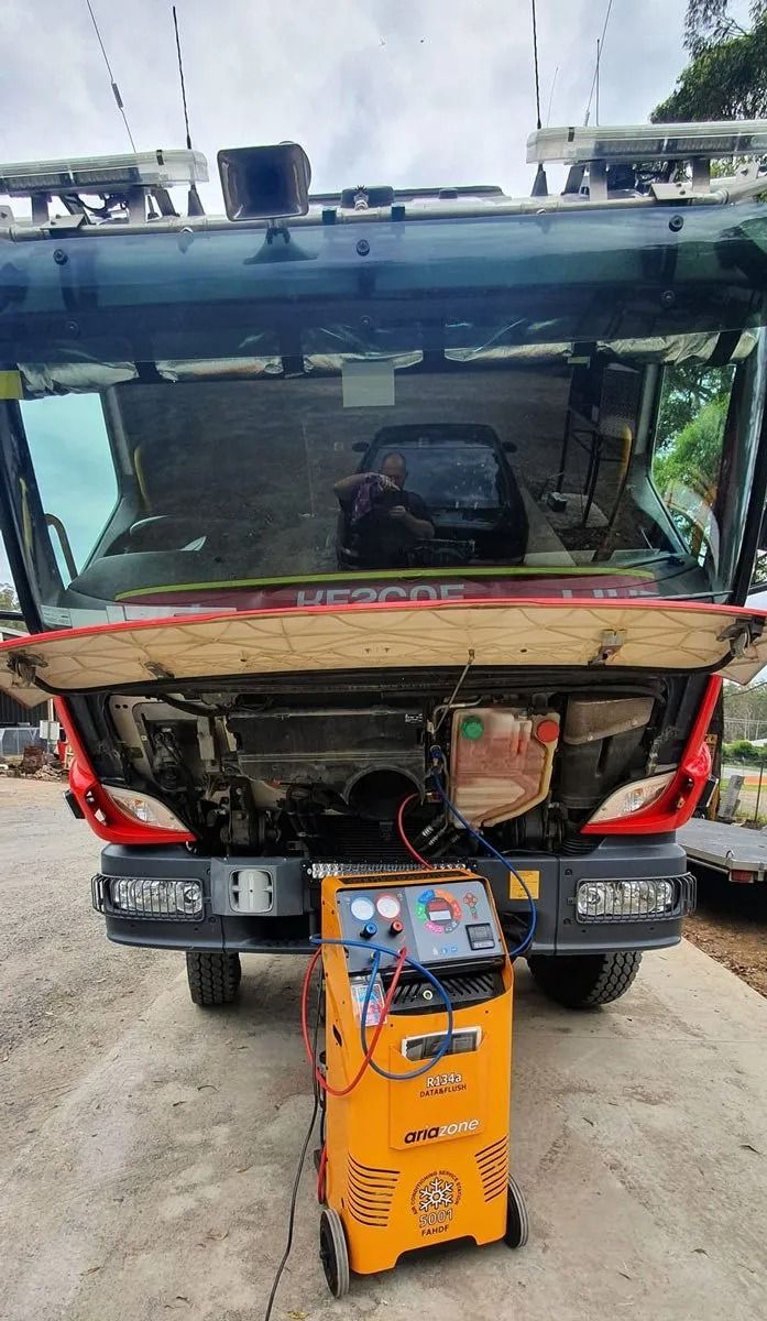 A Yellow Mobile Air Conditioning Service Unit Connected to the Open Front Panel — B & W Commercials In Wauchope, NSW
