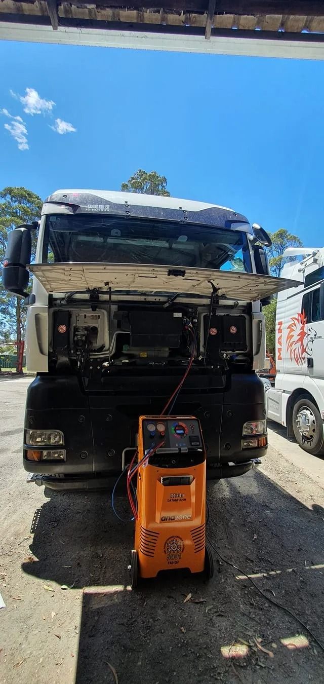 A White Truck With Its Hood Open, Parked Outdoors — B & W Commercials In Wauchope, NSW