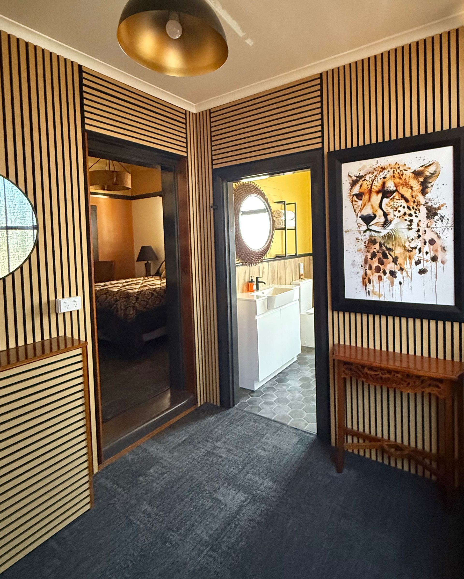 A room with a picture of a tiger on the wall